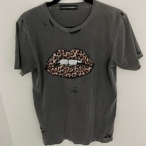 Grey tee. Looser fit.